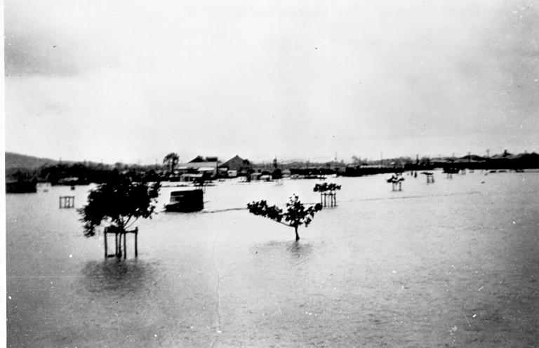 On the road to Garbutt during the floods, Townsville, ca 1946 