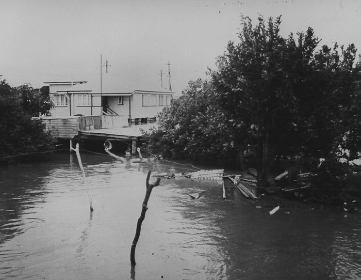 Charlie McKergow at Railway Estate residence during floods, Townsville, 1946 