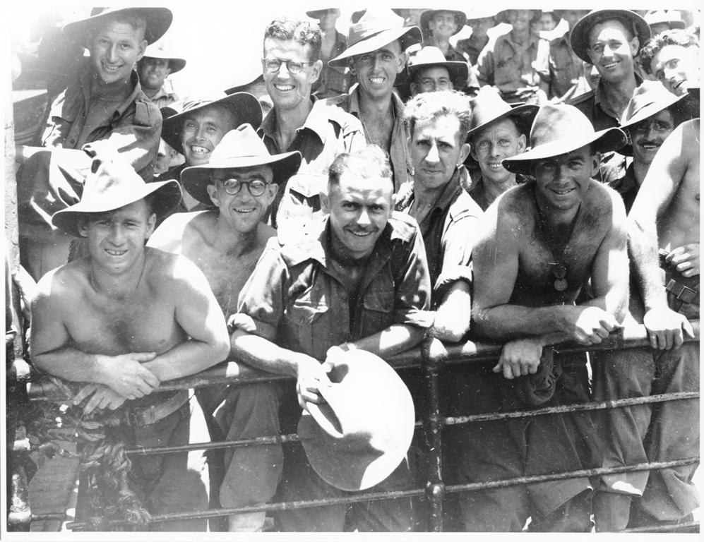 Members of the 24th Aust. Inf. Bde. aboard their transport awaiting disembarkation at Townsville on 28/1/44 after being in action in the Finschhafen area of New Guinea