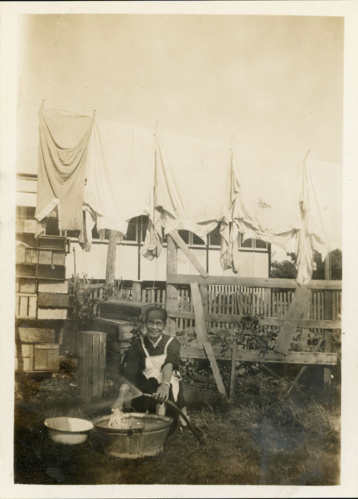 Philip Leong's mother doing the laundry, 1940's
