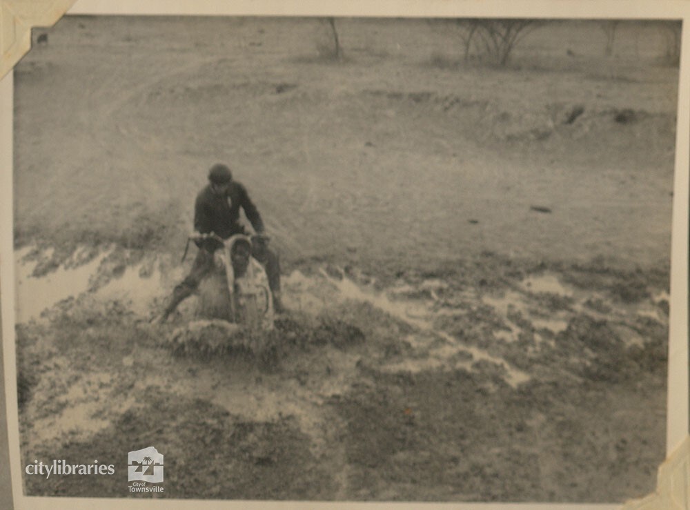 Pat O'Brien during mud motorcycle race, Cluden track, Townsville, 1954