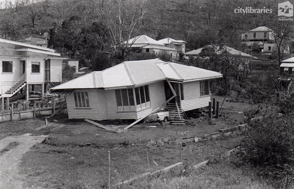 House blown off the stumps by Cyclone Althea with Holden car underneath, Stagpole Street, West End, Townsville, 25 December 1971