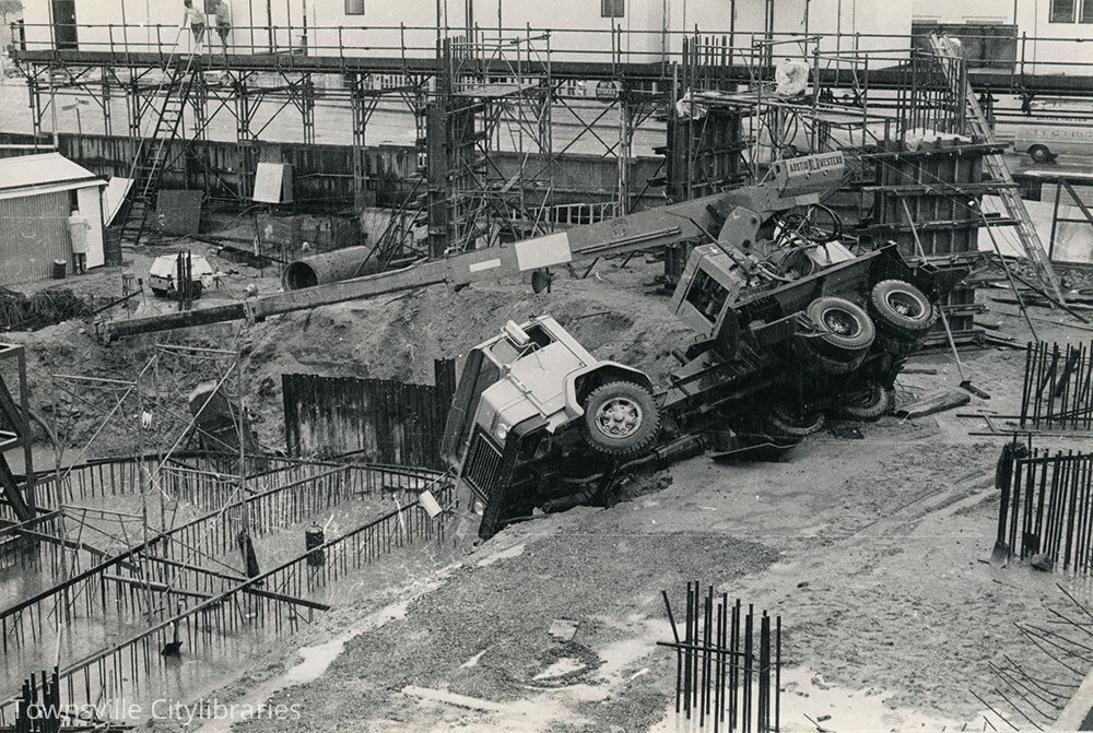 Overturned crane, Hotel Townsville, Townsville, 1974
