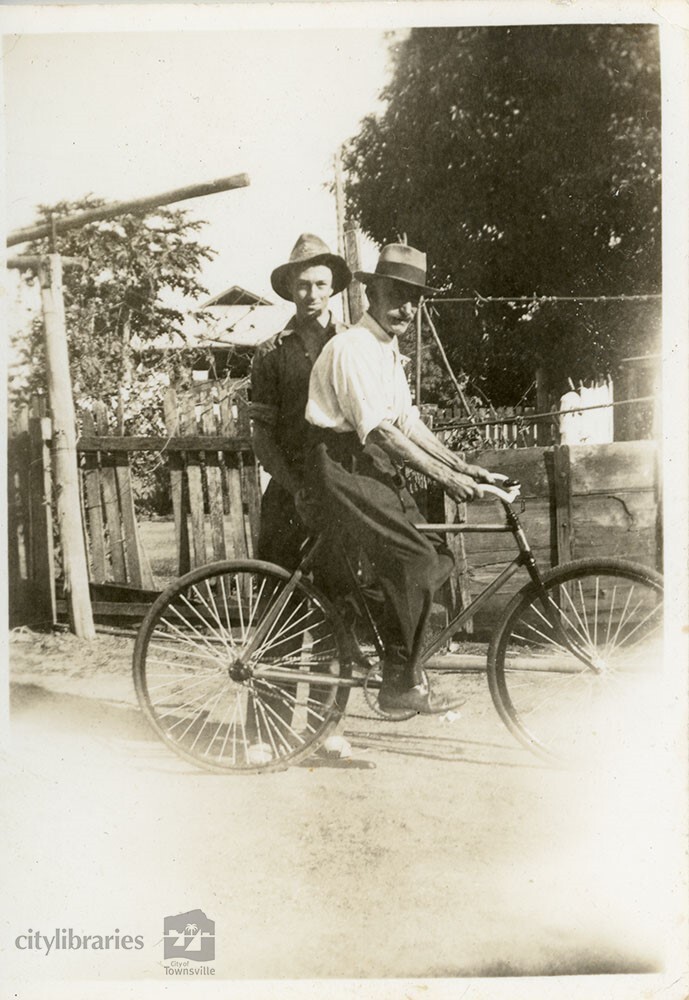 John Hillman and friend with bicycle, Townsville, 19uu