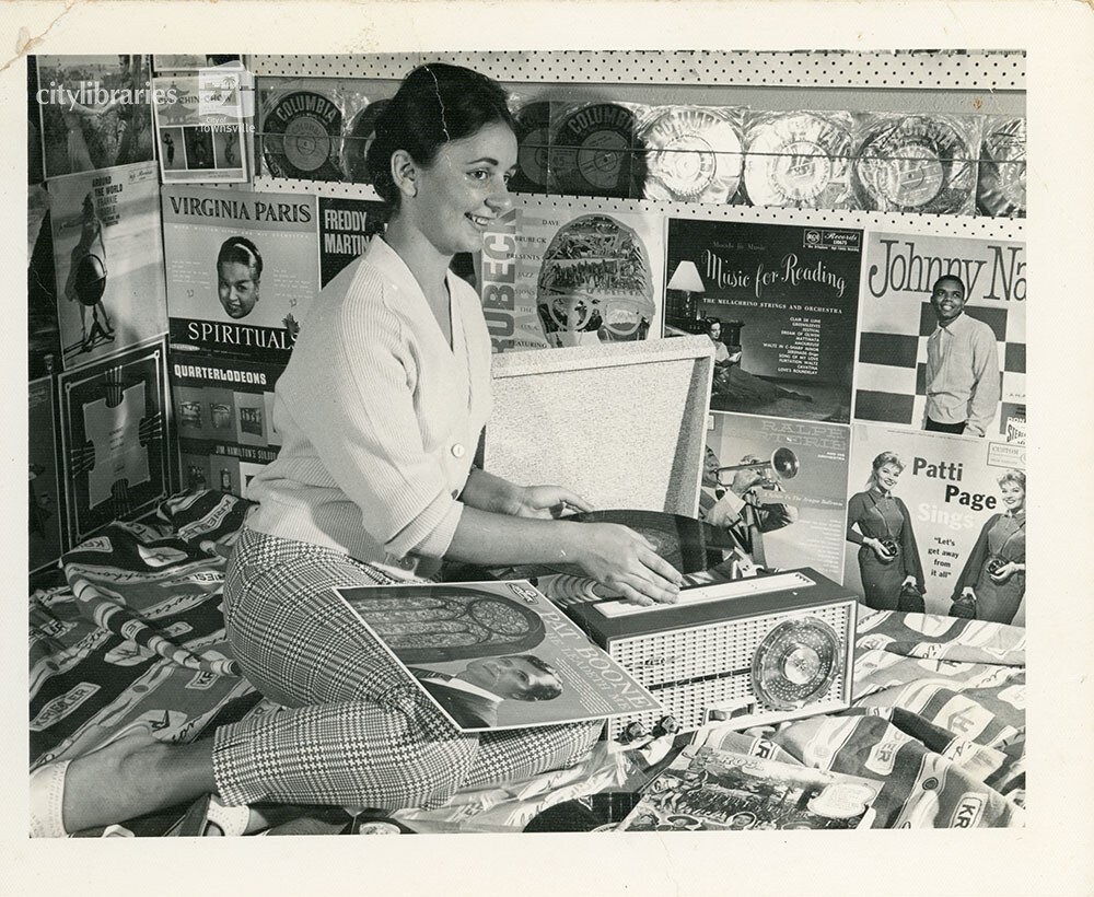 Patricia Hillman in Hillman's Electric Shop, Townsville, ca. 1953