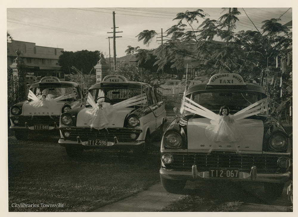 Three decorated taxis, St Matthew's Anglican Church, Townsville