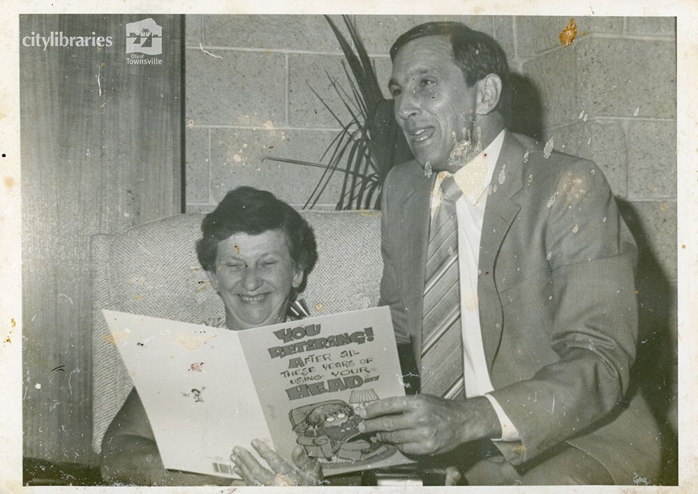 Staff members of Carramar Children's Home with a retirement card, Townsville, ca. 1975