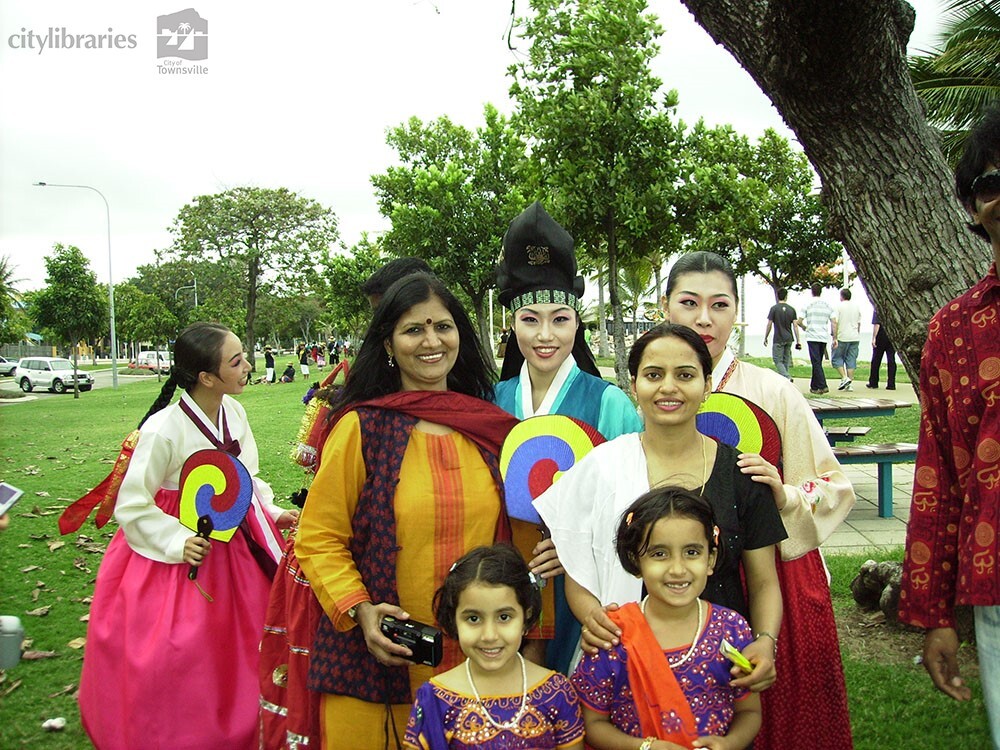 Performers from Suwon City Korea, with members of the Indian Cultural Society after the Tropigo Carnival parade at Cultural Fest, The Strand, Townsville, 18 August 2007