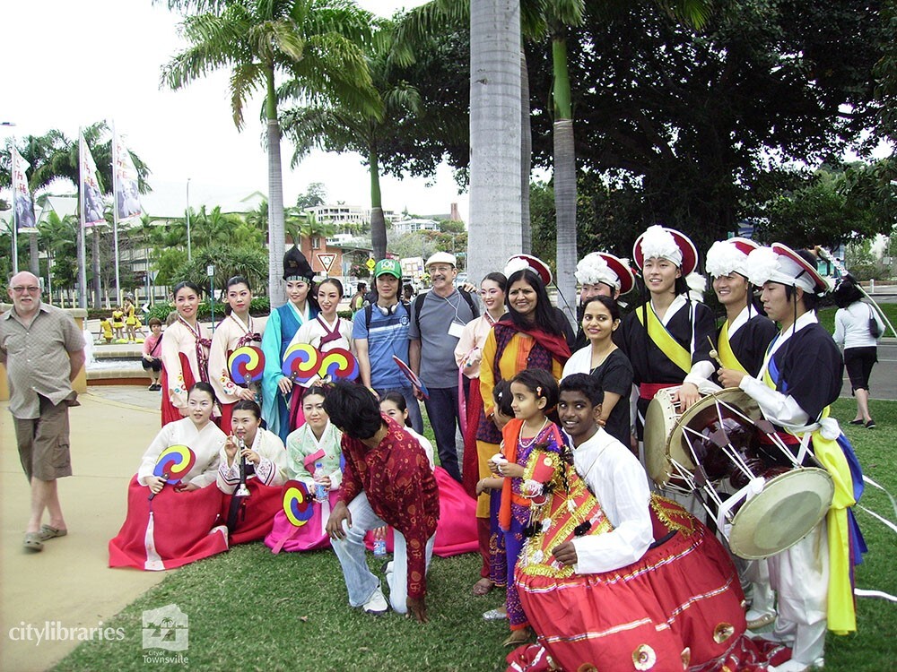 Performers from Suwon City Korea, with members of the Indian Cultural Society after the Tropigo Carnival parade at Cultural Fest, The Strand, Townsville, 18 August 2007