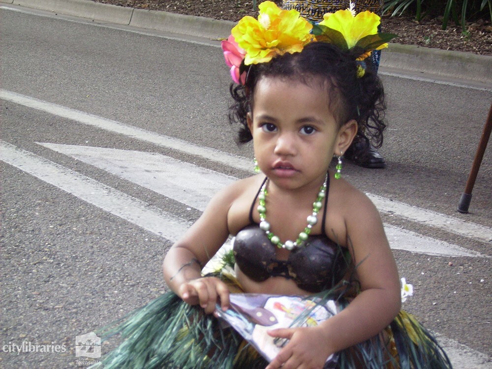 Young performer from Townsville Cook Islands Dance Group in the Tropigo Carnival parade at Cultural Fest, The Strand, Townsville, 18 August 2007