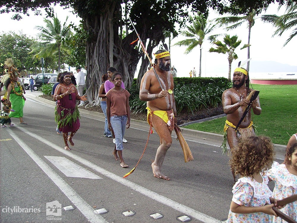 Members of Gulumba Dance Group and Nyarku Undanu and Julbu Julbu Dancers in the Tropigo Carnival parade at Cultural Fest, the Strand, Townsville, 18 August 2007