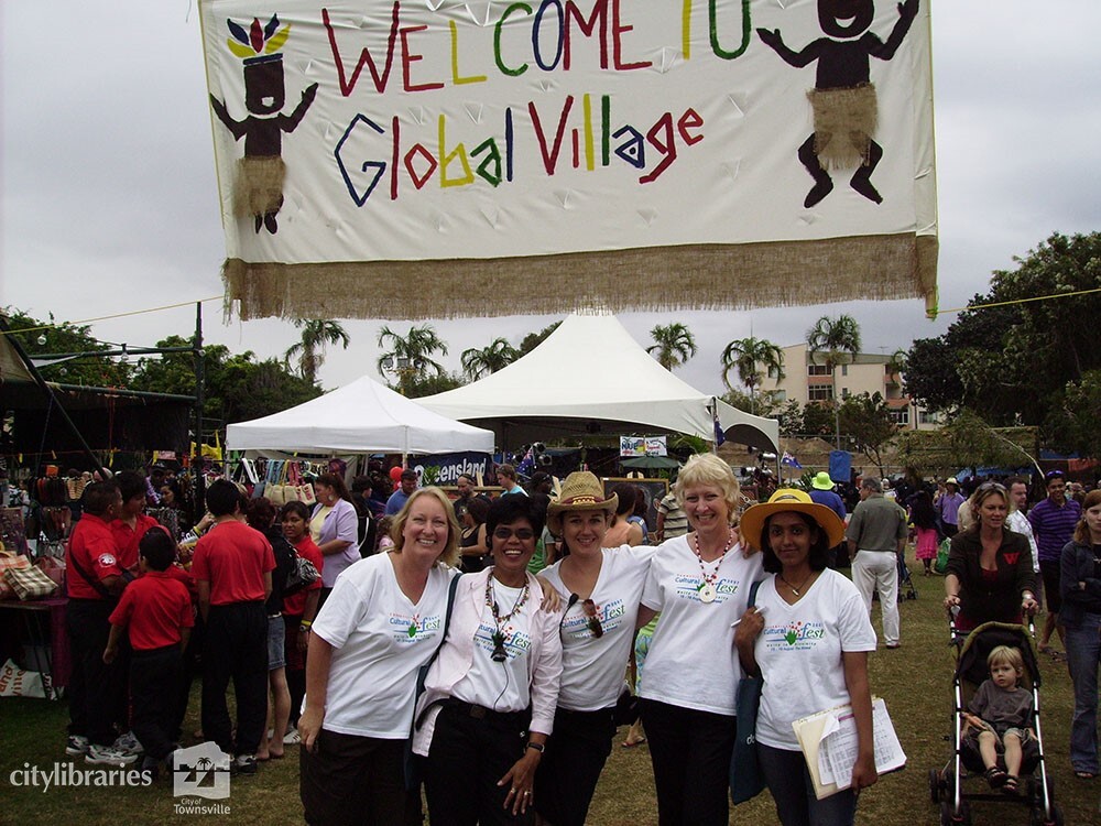 Staff members in front of the Global Village at Cultural Fest, Strand Park, Townsville, 19 August 2007