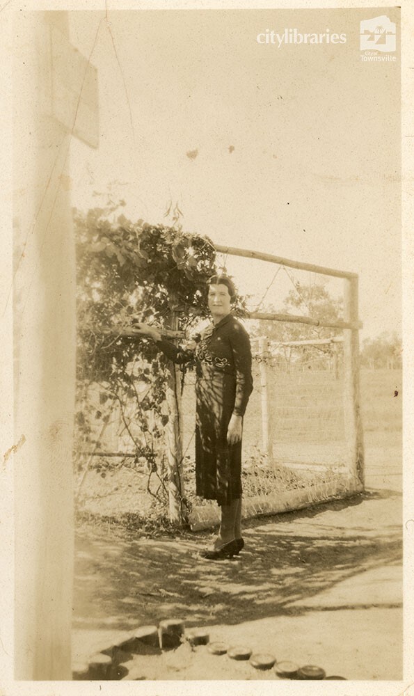 Person posing in a garden, 1939