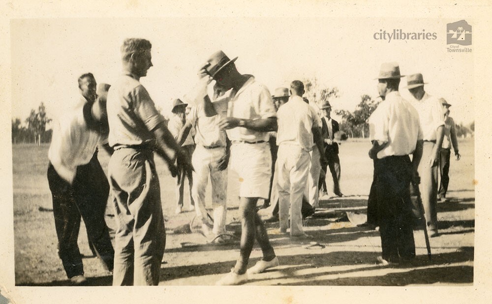 Men after playing a game of tug of war, Townsville, 1936