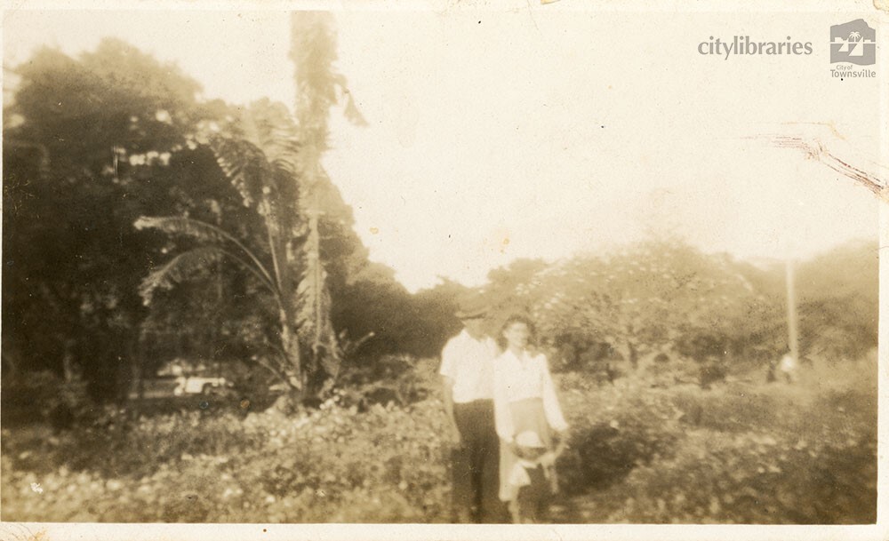 Couple posing in a garden, December 1946
