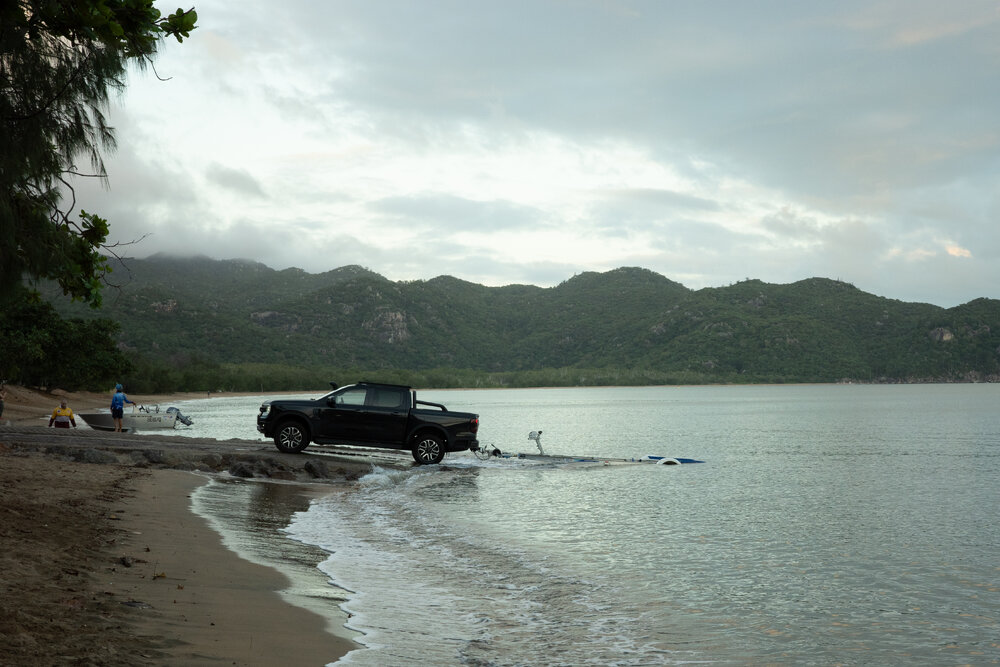 People unload boat from a ute, Horseshoe Bay, Townsville, 3 April 2024