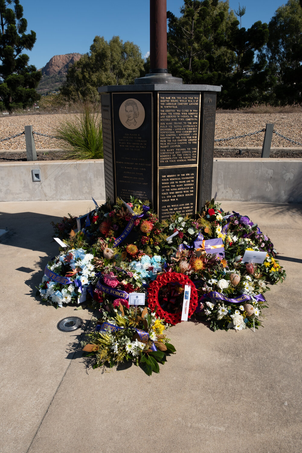 Wreaths in front of a flag pole at Kissing Point Fort, North Ward, Townsville, 16 August 2025