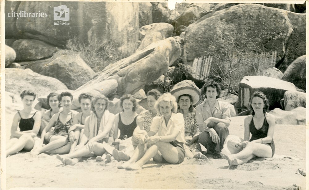 Group of women on a beach, [Townsville], ca. 1945