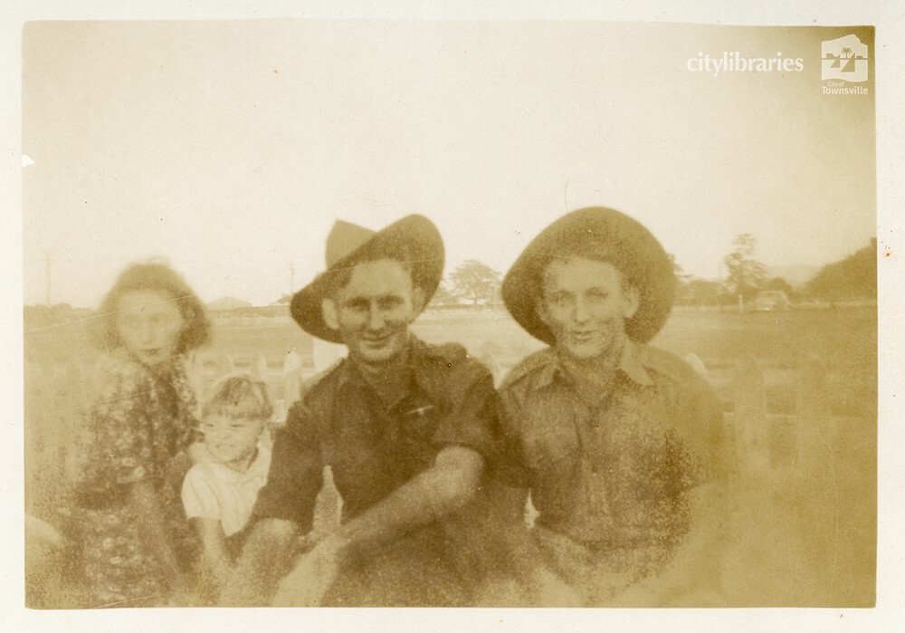Bill and Les with unidentified woman and child, Townsville, ca. 1946