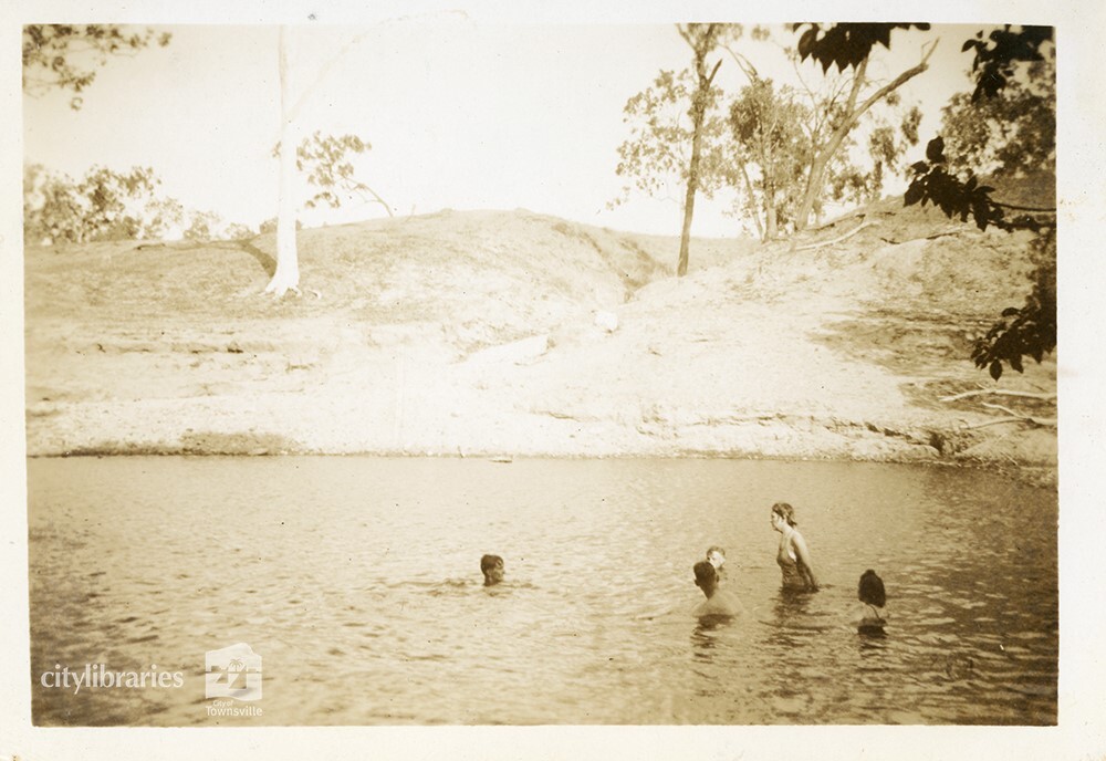 Swimmers in the river at the C.O.D. picnic, Alice River, Townsville, 1946