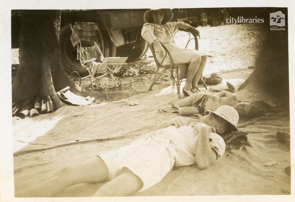 Mr Brown lying down at the C.O.D. picnic, Alice River, Townsville, 1946