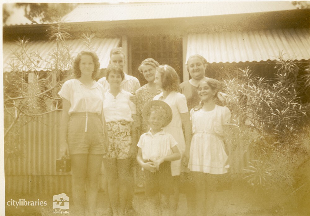 Group posing in front of a house, [Magnetic Island], Townsville, ca. 1946