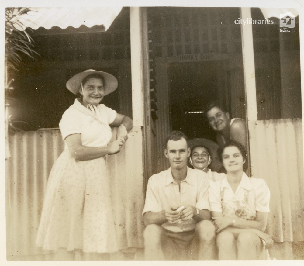 Group posing on a veranda, Townsville, ca. 1946