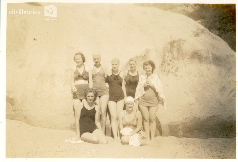 Group posing in front of a rock, [Magnetic Island], Townsville, ca. 1949