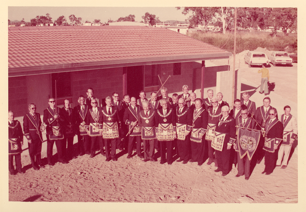 Freemasons in front of the Masonic Home for the Aged under construction, Townsville, 1977