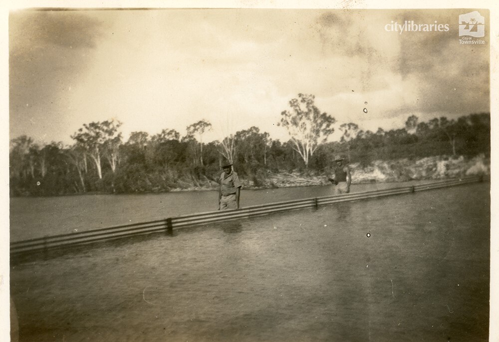 W. Ivers and J. Gerard during works to raise the wall at Black Weir, Townsville, May 1950