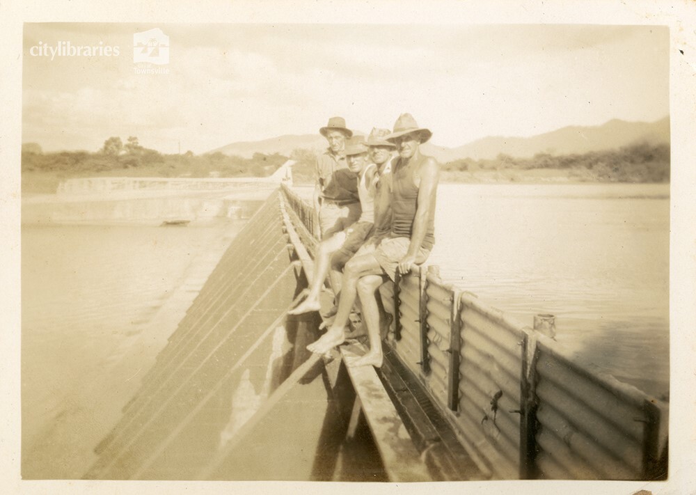 Workers on top of Aplin's Weir during works to raise the wall, Townsville, May 1950