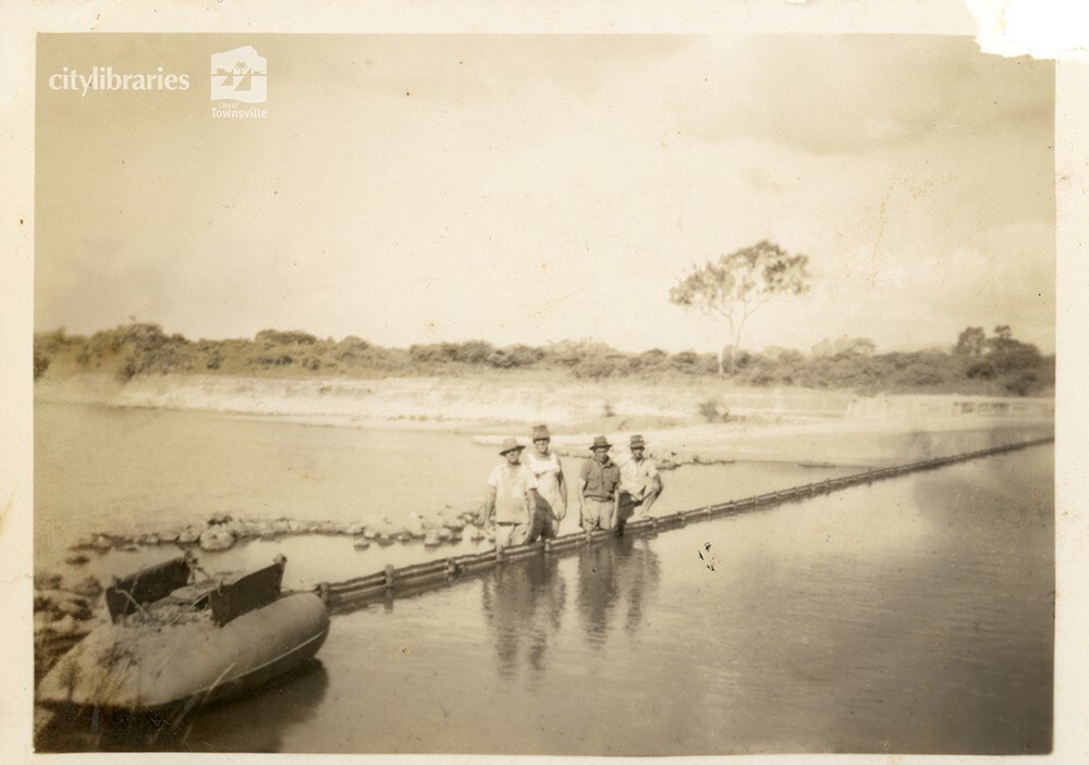 Workers at Aplin's Weir during works to raise the wall, Townsville, May 1950
