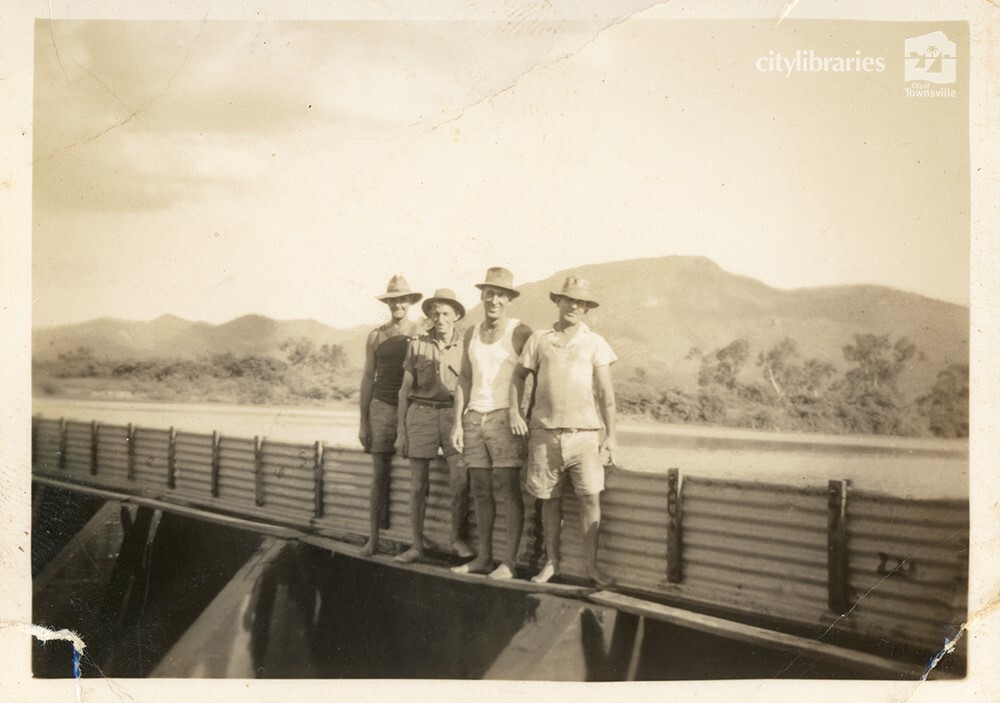 Workers on top of Aplin's Weir during works to raise the wall, Townsville, May 1950