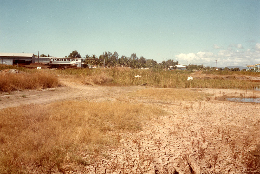 Floodgate on Woolcock canal viewed from Ross Creek, Townsville, 1984