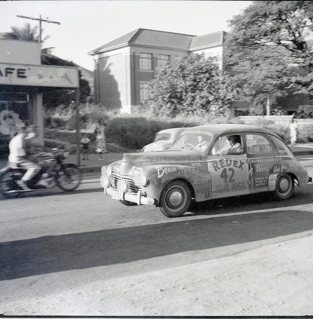 Car 42 in the Redex Trial 1955 on Ingham Road, Townsville. West End Primary School is in the background