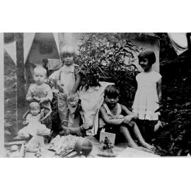 Mount Spec, Col, Winifred, Allan and Marg Stewart with Christmas gifts, second camp, Mount Spec Road, 25 December 1932