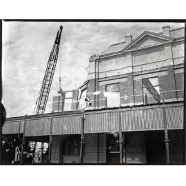 Demolition of the ambulance station, corner of Sturt and Stanley Street, Townsville City, Townsville, 8 September 1968