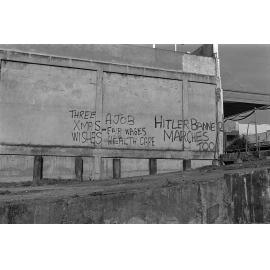 Graffiti on city building, Flinders Street, Townsville, 1979
