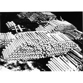 Stack of finished reinforced concrete pipes, Humes Ltd., Thompson Street, Aitkenvale, 1928