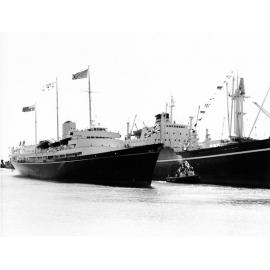 The Royal yacht Britannia, and escort ship, anchored at Townsville during the 1970 royal visit, April 1970