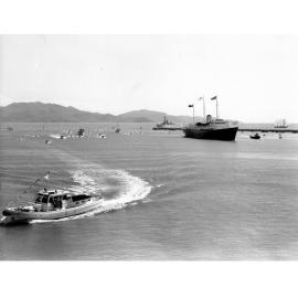 Her Majesty's yacht Britannia, and the Townsville Harbour Board launch M.V. Joyce Hiley, during the 1970 royal visit, April 1970