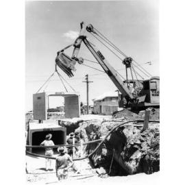 [Installing a culvert], Charters Towers Road, Hermit Park, Townsville, near the Suburban Bowling club, 1967