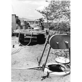 Testing new sewer in Francis Street, West End, Townsville, 1977