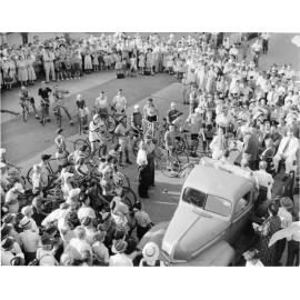 Les Cecil, Jubilee Cyclist, being presented by Mayor J.S. Gill and Chairman of the Townsville Jubilee Celebrations Committee, Alderman J.A. Sherriff, 1951