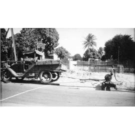Pump operated by motor vehicle, Townsville. 