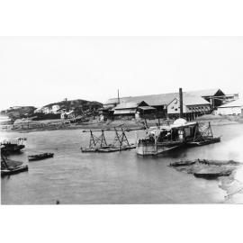 Suction dredge "Mackay" pumping sand ashore near patent slip, 1900. 