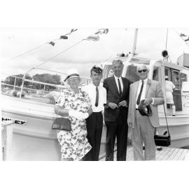 Lady Hiley, Mr Bruce Douglas (responsible for completing the launch), Mr L.E.D. Tomkins, the Chairman of the Townsville Harbour Board and Sir Thomas Hiley, former State Treasurer, stand in front of the Harbour Board launch "Joyce Hiley", 10 December 1966