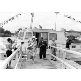 Lady Hiley, Mr L.E.D. Tomlins, the Chairman of the Townsville Harbour Board and Sir Thomas Hiley, former State Treasurer, leave the launch "Joyce Hiley" in Ross Creek after inspecting the new vessel, 10 December 1966