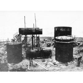 Oil tanks being erected for the shell Oil company, capacity 2,500,000 gal., Magazine Island, 1929. 