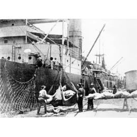 Loading meat, Jetty wharf, Townsville, 1924. 